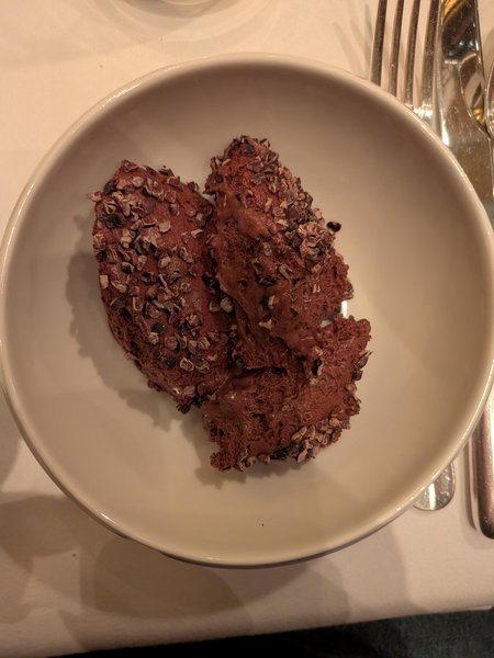 A bowl of mousse au chocolat.

The mousse is very dark and covered in little chocolate flakes.